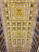 The ornate ceiling of the central nave of the Basilica of St. Paul Outside the Walls, Rome, Italy.