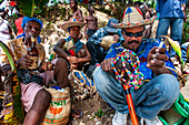 Haiti Voodoo Festival in Saut d'Eau, in Saut d'Eau, Ville Bonheur, Haiti. Thousands of both Vodou and Catholic followers gathered under the Saut d'Eau waterfall in Haiti. The pilgrimage, made by Voodou practitioners and Catholics alike, originated with the sighting of the likeness of the Virgin Mary on a palm leaf close to the falls half a century ago. Catholism and Voodou practices are forever intertwined in its Haitian form. The appearance of a rainbow beneath the falls is said indicate that Danbala - the great lord of the waterfall - and Ayida Wedo - the rainbow - are making love. Fertility