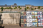 Bouquinistes or book stalls along the River Seine in Paris near Notre Dame Cathedral, Riverside Bouquinistes, green boxes selling second hand books along Quai Malaquais on the banks of The River Seine.