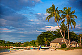 Tourists in white sand beach in of Langub Beach Malapascua island, Cebu, Philippines