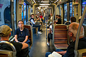 Passengers on the Paris Metro, Paris, France