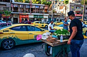 Almonds and Baleela and Fule, a traditional street food, made from beans, persley and lemon, seen for sale near the Roman Theatre, in the Old Town of Amman, Jordan