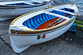 Wooden rowboats hauled out on the ramp in the Marina Grande harbor on the island of Capri, Italy.