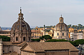 Domes of the Church of Saints Luca and Martina & the Church of the Most Holy Name of Mary at the Trajan Forum in Rome, Italy, with Trajan's Column between.