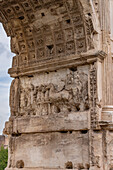 Detail of the Arch of Titus in the Roman Forum in the Colosseum Archaeological Park, Rome, Italy. Depicted is Titus in his chariot.