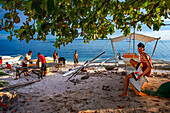 Local fishers in Guimbitayan beach next to white sand beach in Malapascua island, Cebu, Philippines