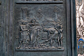 Detail of the bronze door of the main portal of the Basilica of St. Paul Outside the Walls, Rome, Italy.