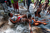 Haiti Voodoo Festival in Saut d'Eau, in Saut d'Eau, Ville Bonheur, Haiti. Thousands of both Vodou and Catholic followers gathered under the Saut d'Eau waterfall in Haiti. The pilgrimage, made by Voodou practitioners and Catholics alike, originated with the sighting of the likeness of the Virgin Mary on a palm leaf close to the falls half a century ago. Catholism and Voodou practices are forever intertwined in its Haitian form. The appearance of a rainbow beneath the falls is said indicate that Danbala - the great lord of the waterfall - and Ayida Wedo - the rainbow - are making love. Fertility