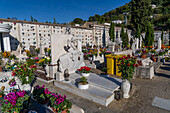 A cherub statue marker on a grave in a cemetery in Anacapri on the island of Capri, Italy.