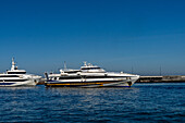 Two high-speed passenger ferries in the harbor at Marina Grande on the island of Capri, Italy.