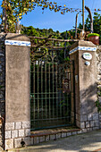 Gate to a private residence and gardens in the resort town of Anacapri on the island of Capri, Italy.