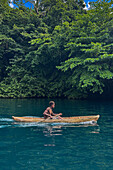 Residents of Vitu Islands in their traditional dugout canoes, Garove Island, Johann Albrecht Harbour, Papua New Guinea