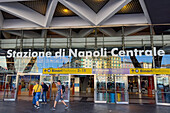 Passengers in front of the Central Train Station in Naples, Italy.