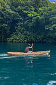 Residents of Vitu Islands in their traditional dugout canoes, Garove Island, Johann Albrecht Harbour, Papua New Guinea