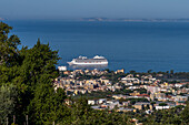 A cruise ship in the Bay of Naples approaching the harbor of Sorrento, Italy.