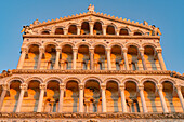 The west facade of the Pisa Duomo or Primatial Metropolitan Cathedral of the Assumption of Mary in Pisa, Italy.