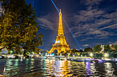 Eiffel Tower with Olympic rings at night, Paris, France