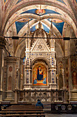 The elaborate carved marble tabernacle in the Orsanmichele Church in Florence, Italy. Created between 1355 and 1359 by Andrea Orcagna.