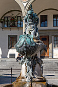 Fountain statue of a sea monster on the Piazza Santissima Annunciata, Florence, Italy.