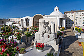 A cherub statue marker on a grave in a cemetery in Anacapri on the island of Capri, Italy.