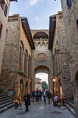 The Via San Giovanna passes through the Porta San Giovanni into the medieval city of San Gimignano, Italy.