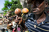 Haiti Voodoo Festival in Saut d'Eau, in Saut d'Eau, Ville Bonheur, Haiti. Thousands of both Vodou and Catholic followers gathered under the Saut d'Eau waterfall in Haiti. The pilgrimage, made by Voodou practitioners and Catholics alike, originated with the sighting of the likeness of the Virgin Mary on a palm leaf close to the falls half a century ago. Catholism and Voodou practices are forever intertwined in its Haitian form. The appearance of a rainbow beneath the falls is said indicate that Danbala - the great lord of the waterfall - and Ayida Wedo - the rainbow - are making love. Fertility