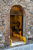 A wine shop on Via San Giovanni in the medieval walled city of San Gimignano, Italy.