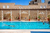 The swimming pool area of the Movenpick Resort Hotel near Petra and Wadi Musa, Hashemite Kingdom of Jordan, Middle East.