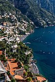 The seaside resort town of Positano terraced on the steep hillside of the Amalfi Coast in Italy.