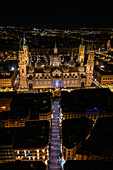 Aerial view of the Cathedral Basilica of Our Lady of the Pillar and Alfonso Street illuminated at night during Christmas, Zaragoza, Spain