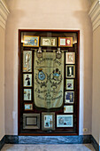 Thank offerings and an antique banner in the crypt of the Basilica of Sant'Antonino, Sorrento, Italy.