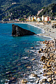 The Fegina beach in off peak season in Monterosso al Mare, Cinque Terre, Italy, with the Scoglio Malpasso or Malpasso Rock.