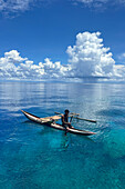 Resident of Vitu Islands in their traditional dugout canoes, Lama Anchorage, New Britain, Papua New Guinea