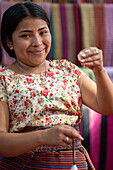 Woman spinning Cotton San Juan la Laguna, Lake Atitlan, Guatemala