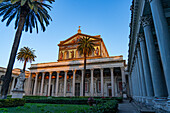 The statue of St. Paul and facade of the Basilica of St. Paul Outside the Walls, Rome, Italy.