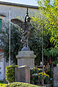 A bronze war memorial statue commemorating the men from Anacapri that died in World War I. Anacapri, Italy.