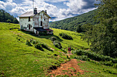 Trekking, Casa de los mikeletes house on the way to the San Adrián tunnel on the Aizkorri mountain range at the Basque Country, Goierri, Basque Highlands Basque Country, Euskadi Spain.