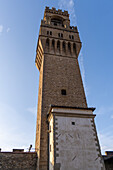 Die Rückseite des Arnolfo-Turms am Palazzo Vecchio in Florenz, Italien.