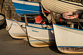 Boats out of the water by the harbor in Riomaggiore, Cinque Terre, Italy.