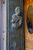 A bas relief of St. Matthew on the bronze door of the Church of San Gennaro in Vettica Maggiore, Praiano, Italy.