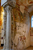 A Corinthian column & frescoes in the Diocesan Museum of Amalfi, Italy. This museum is housed in the Basilica of the Crucifix, adjacent to the Amalfi Duomo.