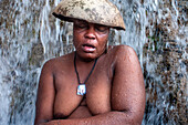 Haiti Voodoo Festival in Saut d'Eau, in Saut d'Eau, Ville Bonheur, Haiti. Thousands of both Vodou and Catholic followers gathered under the Saut d'Eau waterfall in Haiti. The pilgrimage, made by Voodou practitioners and Catholics alike, originated with the sighting of the likeness of the Virgin Mary on a palm leaf close to the falls half a century ago. Catholism and Voodou practices are forever intertwined in its Haitian form. The appearance of a rainbow beneath the falls is said indicate that Danbala - the great lord of the waterfall - and Ayida Wedo - the rainbow - are making love. Fertility