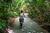 Ride a bicycle in luxury water villas of Six Senses Laamu maldives luxury resort villas, Laamu Atoll region Maldives