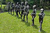 The Skeleton Men from the Omo Bugamo tribe of Papua New Guinea paint their bodies with black and white paint emulating the human skeleton, Chimbu Province, Papua New Guinea