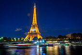 Eiffel Tower in the night with river Seine, Paris, Île-de-France, France