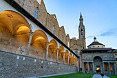 The campanile or bell tower & Pazzi Chapel in the cloisters of the Basilica of Santa Croce in Florence, Italy.