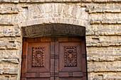 Detail of the carved wooden door into the medieval Basilica di San Lorenzo in Florence, Italy.