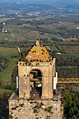 Flock of Hooded Crows on top of Torre Rognosa or Rognosa Tower in the medieval walled town of San Gimignano, Italy.