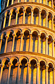 Detail of the Leaning Tower of Pisa, the campanile or bell tower of the Duomo or Cathedral of Pisa. Pisa, Italy. Shadows create a pattern with the columns.