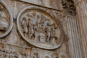 Detail of the Arch of Constantine, a triumphal arch in the Colosseum Archeological Park in Rome, Italy.